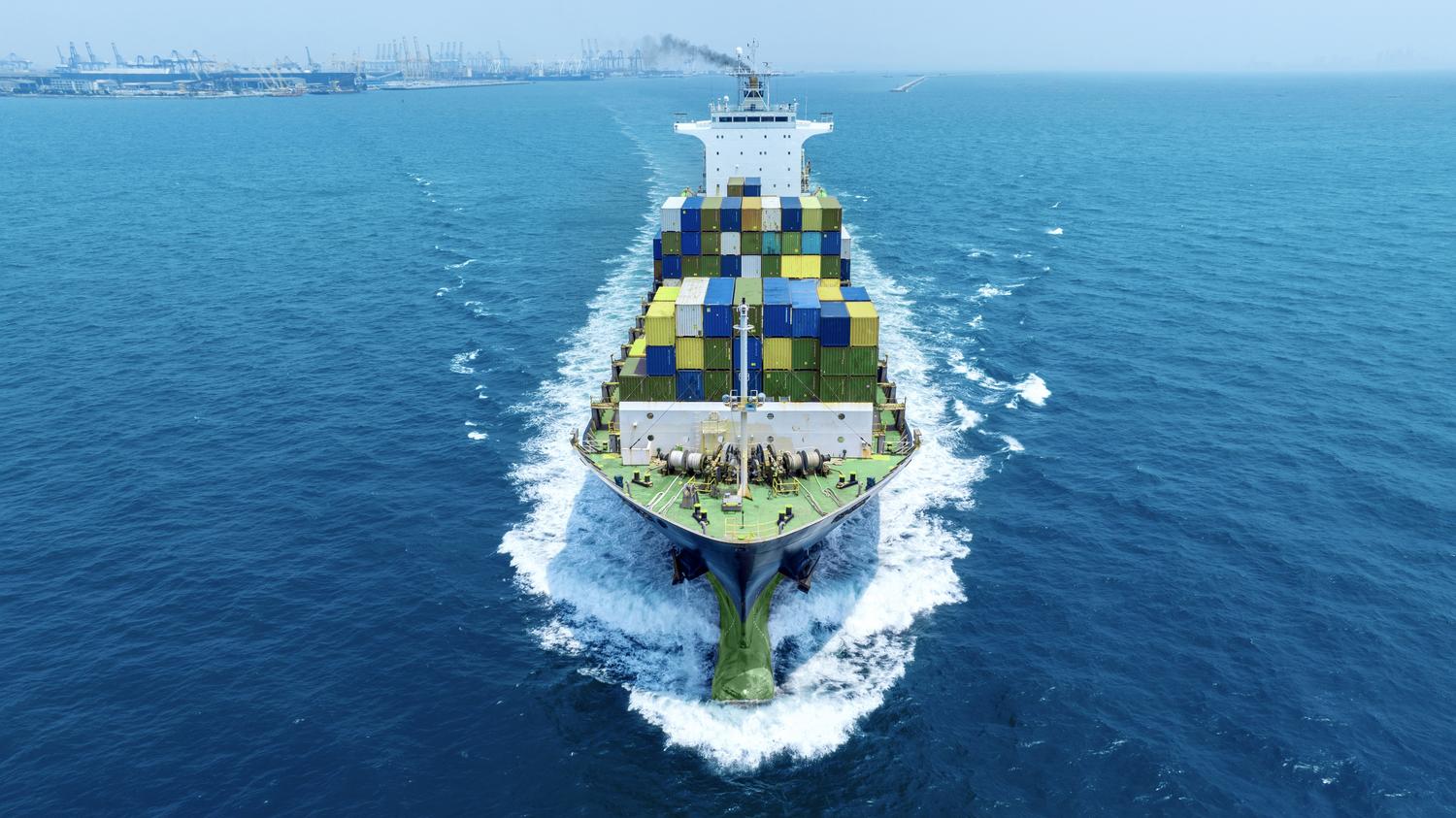 Container Cargo ship cutting through water